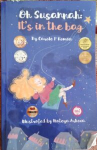 Children's book OH SUSANNAH: IT'S IN THE BAG by CAROLE P ROMAN book cover for the segilola salami show podcast book review